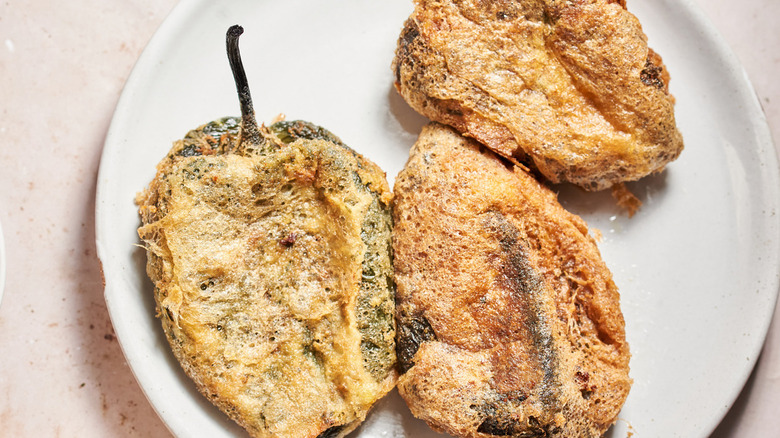 fried chiles rellenos on plate