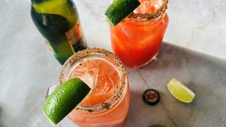 micheladas with lime wedges