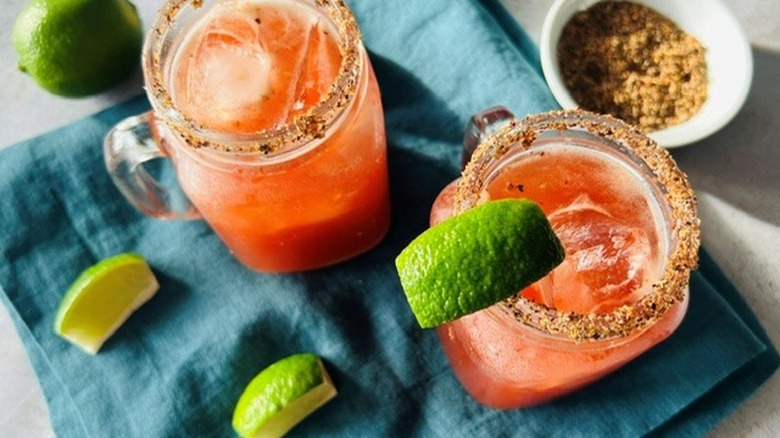 micheladas with lime wedges