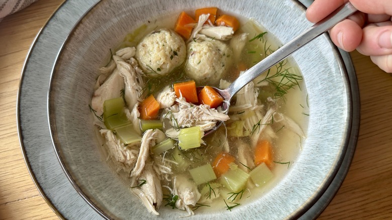 Matzo ball soup in bowl