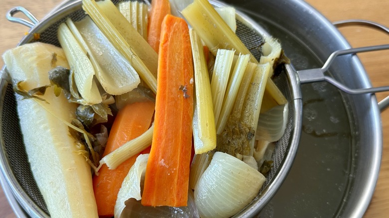 Straining chicken soup