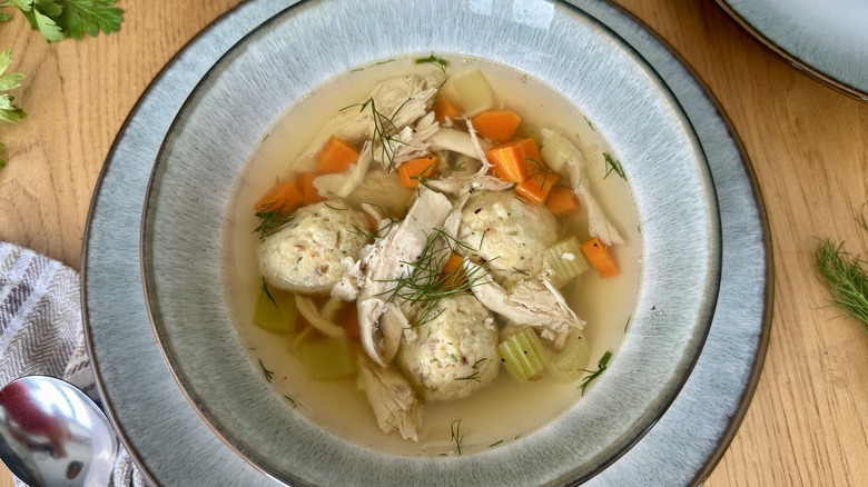 Chicken soup with matzo balls in bowls