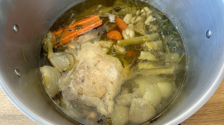 Cooked chicken soup in pot