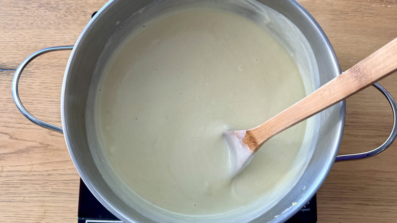 Potato leek soup in pot with cream