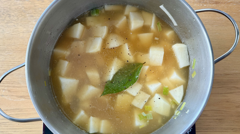 Potato leek soup cooking in pot