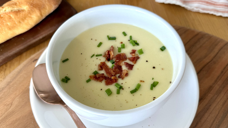 Potato leek soup garnished with bacon and chives