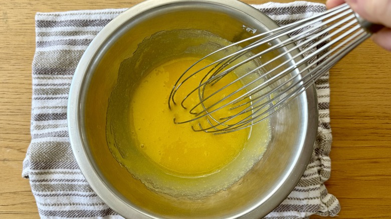 Egg yolks whisked in bowl