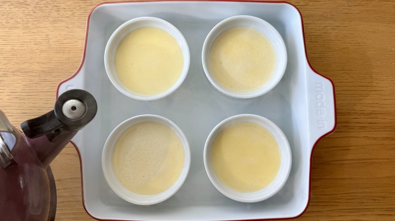 Filling baking dish with boiling water