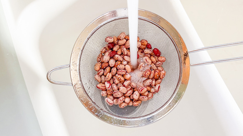 Rinsing cranberry beans in strainer