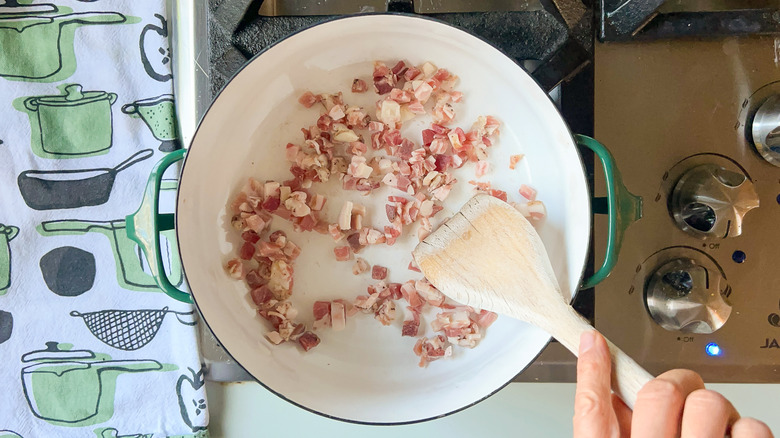 Cooking pancetta in pot on stove