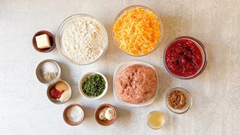 Classic sausage balls with cranberry mustard ingredients on countertop