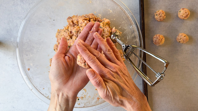 Rolling classic sausage balls with hands