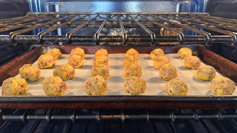 Sheet pan with classic sausage balls in oven