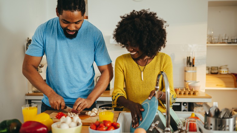 People cooking and cleaning in a kitchen