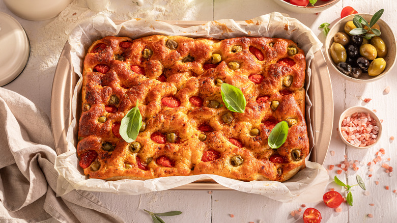 Focaccia with herbs, olives, and tomatoes