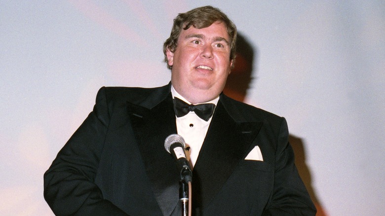 actor John Candy wearing tuxedo