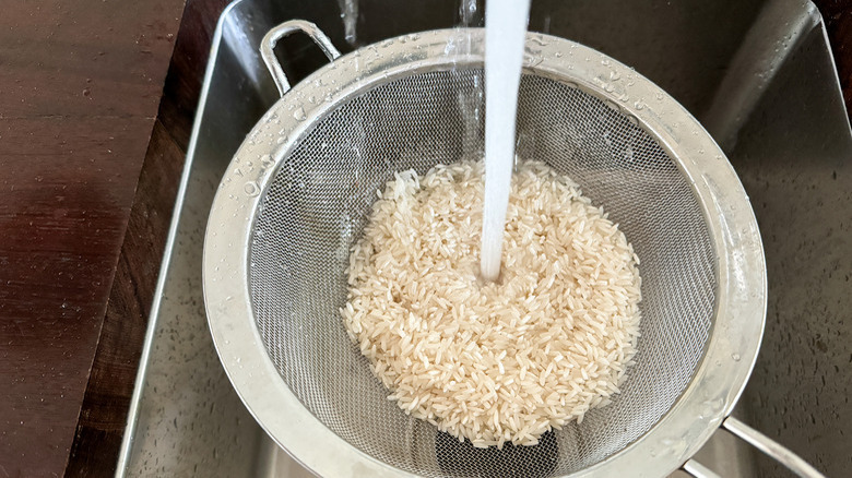 Rice rinsed in a strainer