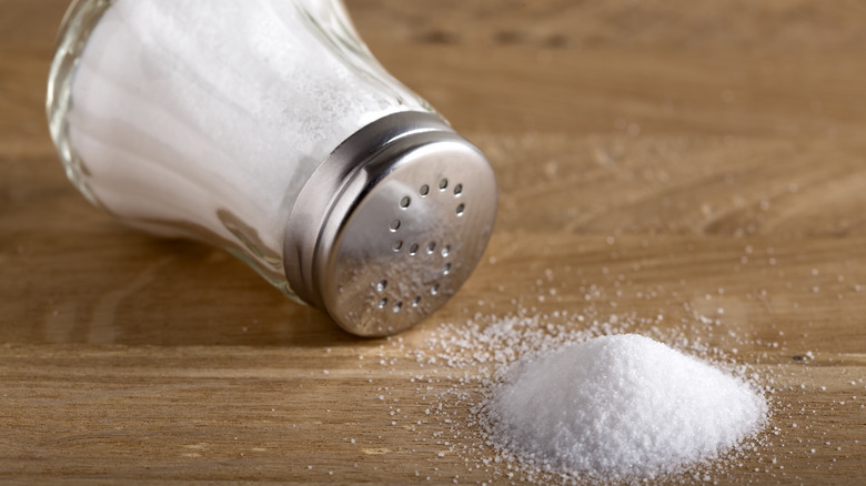 Salt with shaker on table