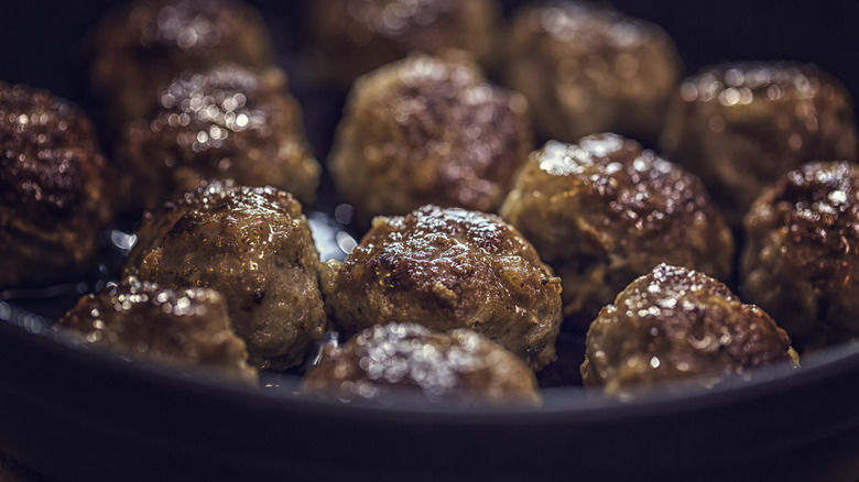 Meatballs roasting in pan