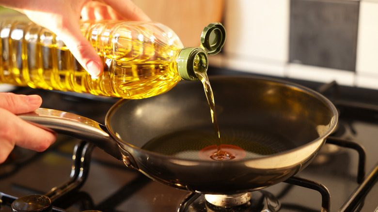 Pouring oil in pan