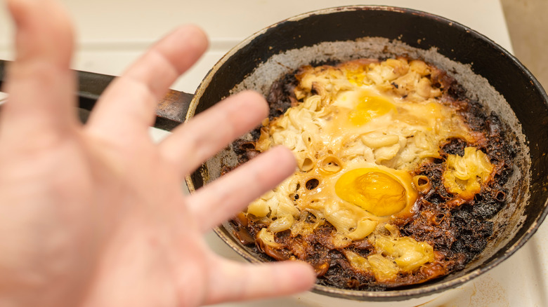 Burnt eggs in pan