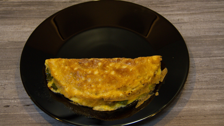 Flipped omelet on plate
