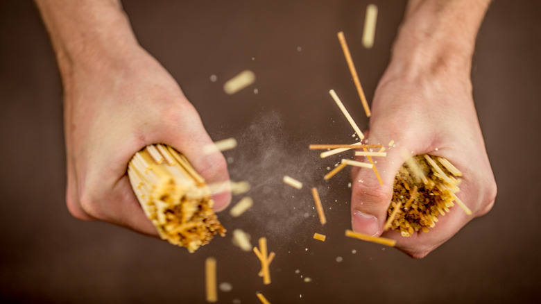 Hand breaking spaghetti