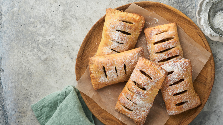 hand pies on a wooden plate