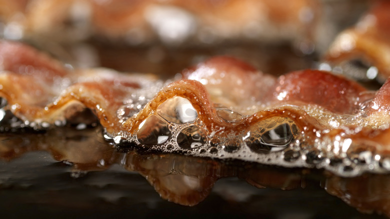 Close-up of bacon in fat