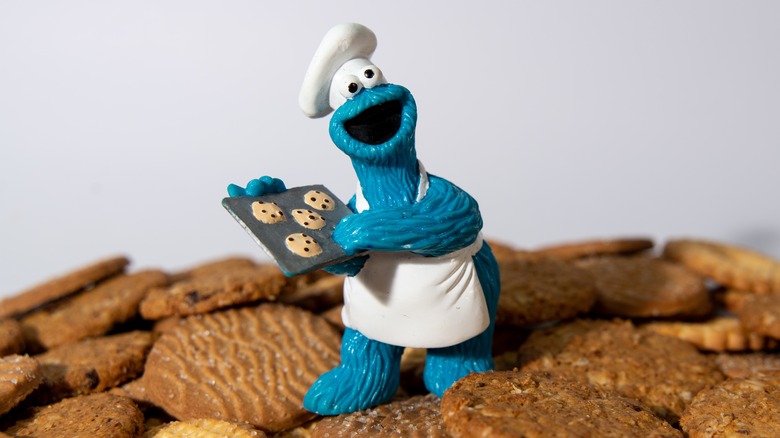 Cookie Monster figurine on pile of cookies
