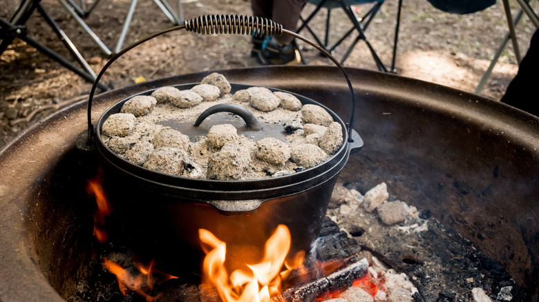 Dutch oven with coals on the lid