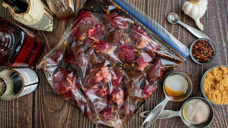 Meat marinating in a plastic bag