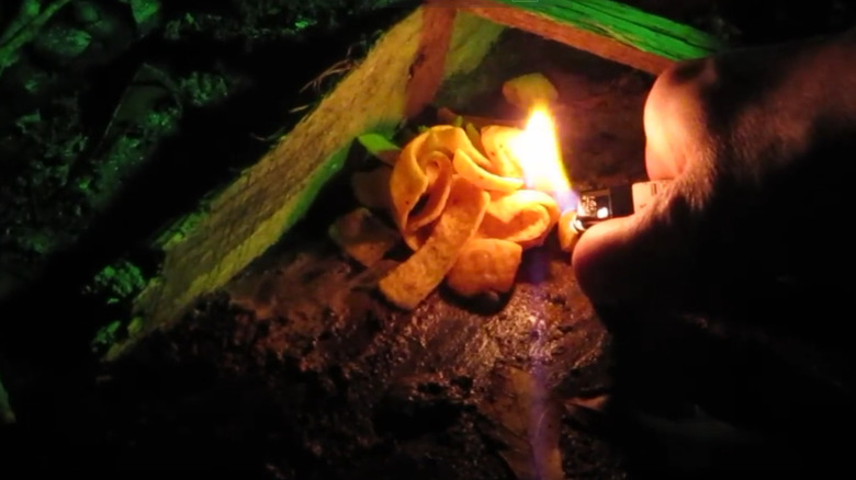 Corn chips on a fire as fire starters