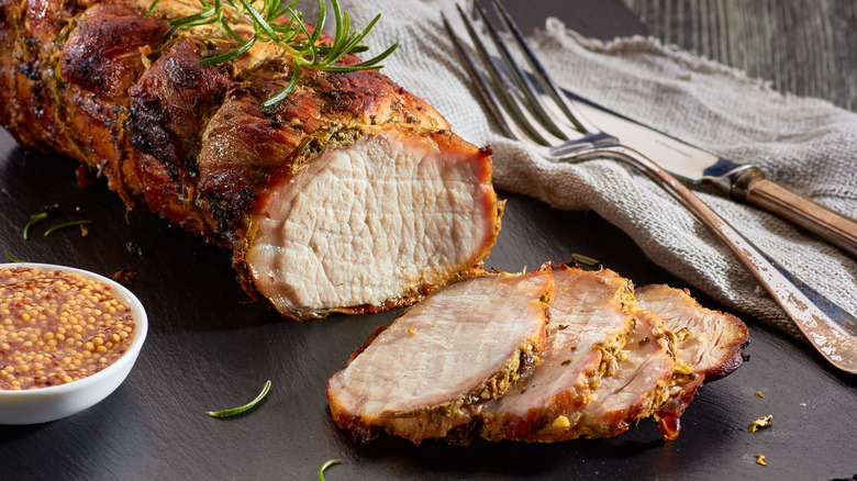 Pork tenderloin sliced with mustard