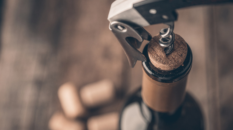 wine cork attached to corkscrew