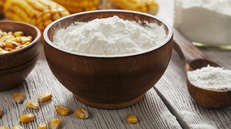 A wooden bowl contains cornstarch.