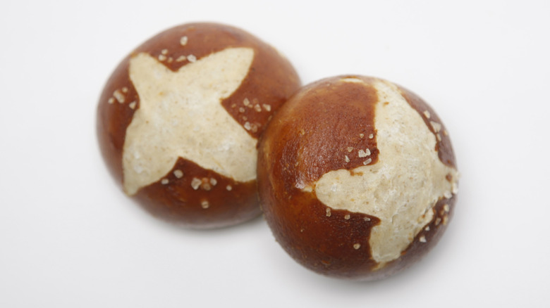 close-up of two pretzel buns