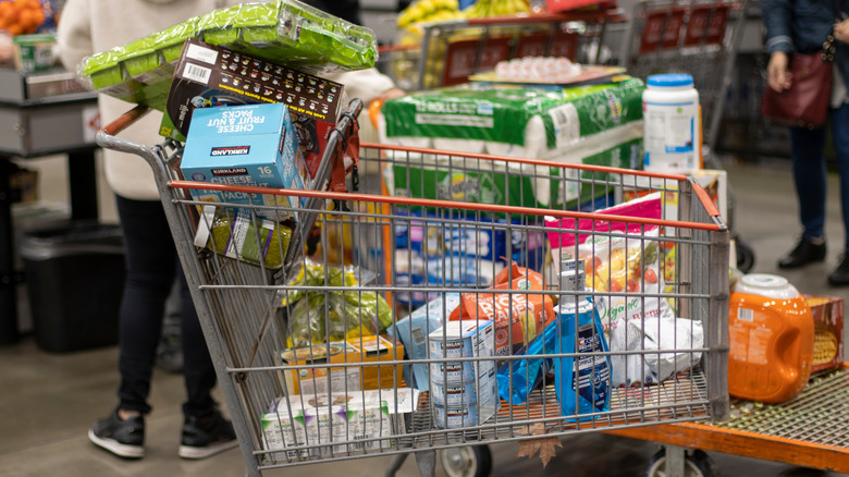 Costco cart containing assorted groceries