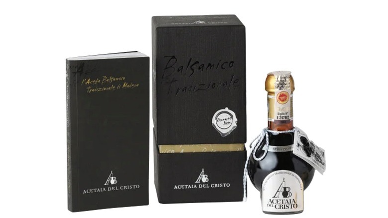 Balsamic vinegar in round glass bottle with black box