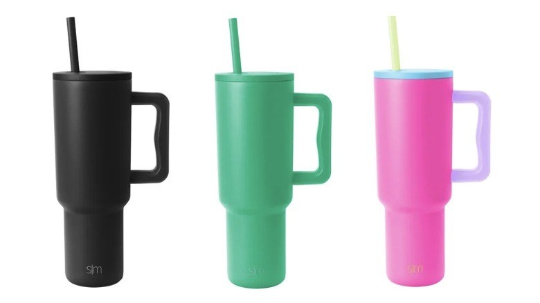 One black, one green, and one pink tumbler cup