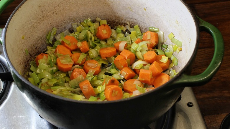 pot with sauteed carrots and leeks