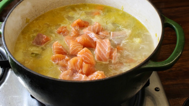 salmon poaching in soup