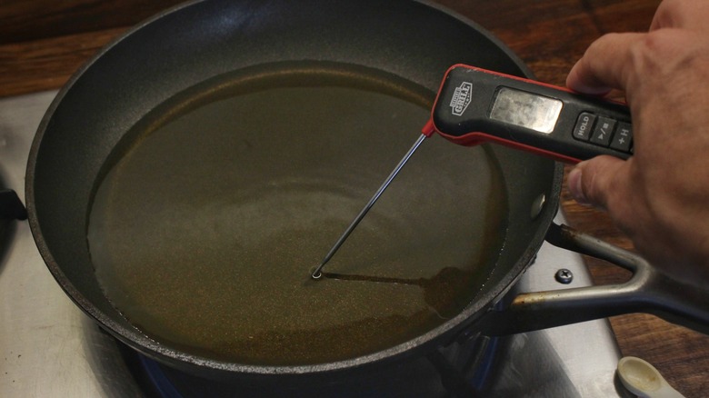 thermometer in skillet of oil