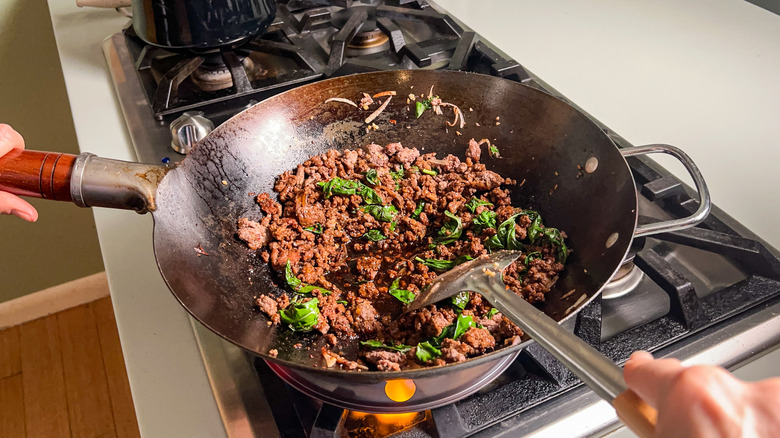 beef and basil in wok