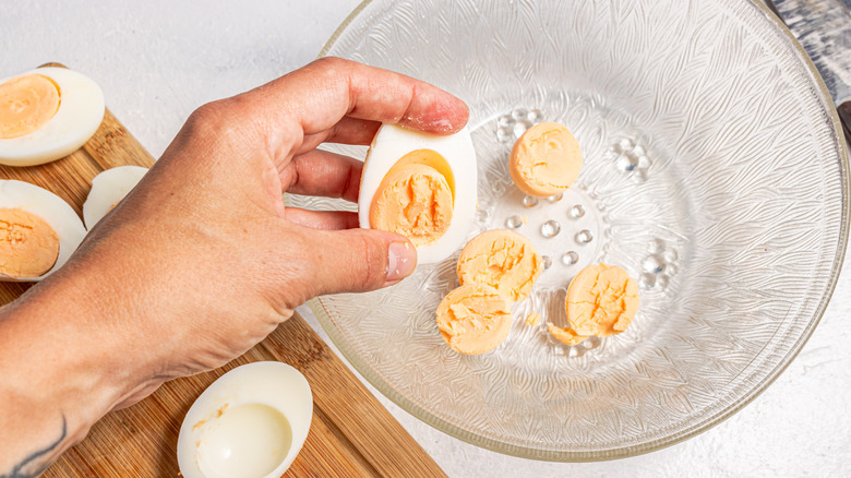 Removing cooked egg yolk from the egg white