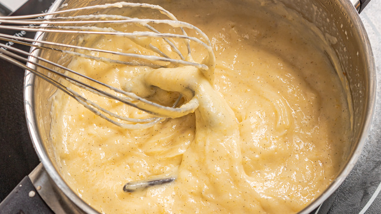 Whisking pastry cream in a saucepan