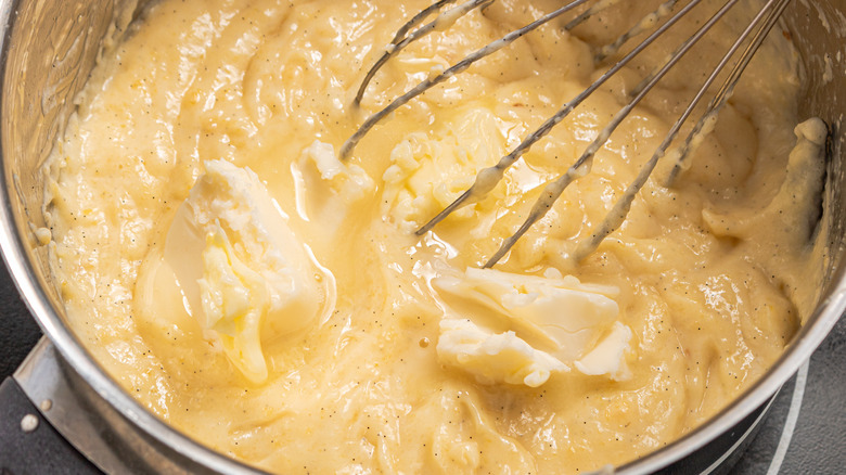 Whisking butter into a pastry cream