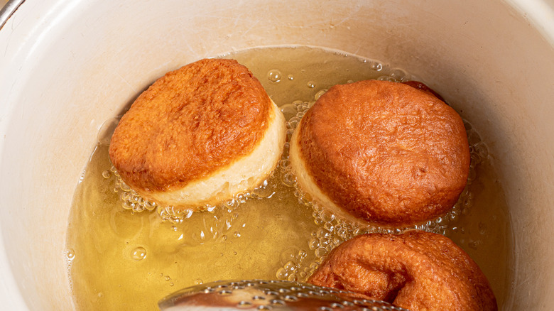 Frying donuts in oil