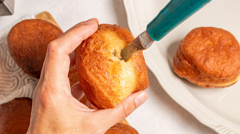 Making a hole inside a donut with a small knife