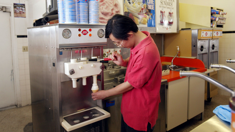 Dairy Queen employee pouring soft serve